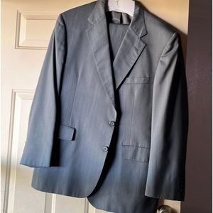 we are selling a brand new suit that is a grey ish blueish color